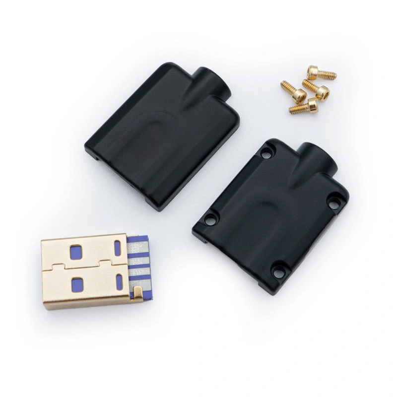Disassembled USB A Housing CNC - V1 kit featuring a gold USB plug, two black metallic casing parts, and four small gold screws neatly arranged on a white background.