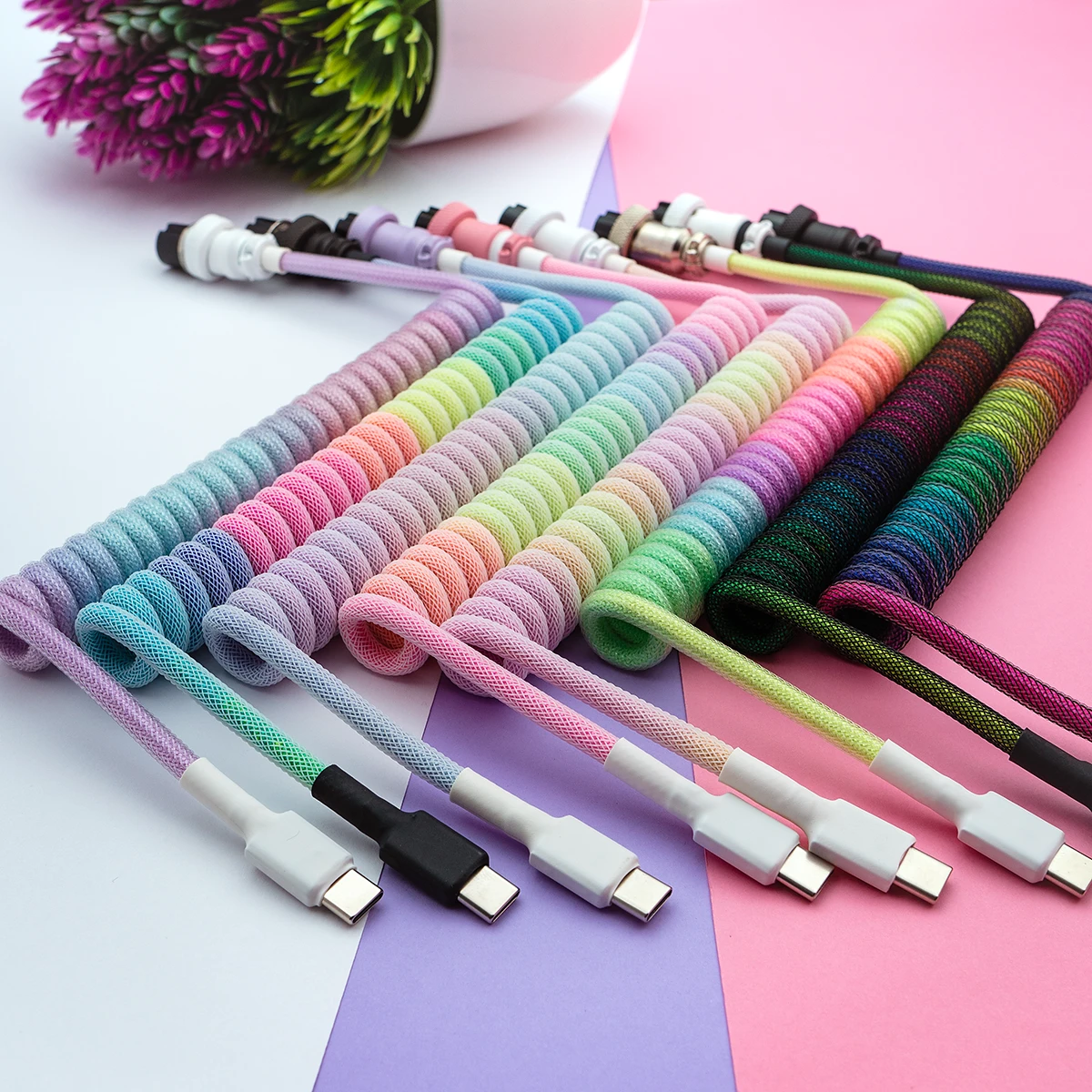 Colorful keyboard cables featuring various coil lengths, detachable USB-C and micro-USB connectors, and durable braiding for enhanced flexibility.