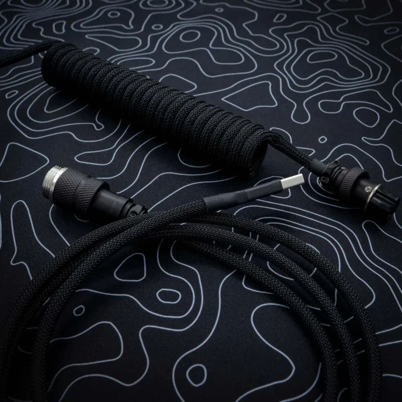Custom black keyboard cable featuring a coil section, USB connectors, and high-quality paracord braiding. Ideal for enhancing your setup.