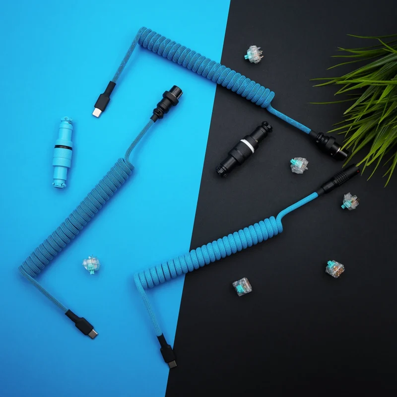 Custom coiled keyboard cable in vibrant blue paracord. Features USB-C and aviator connectors, detachable plugs, and a sleek braided finish.