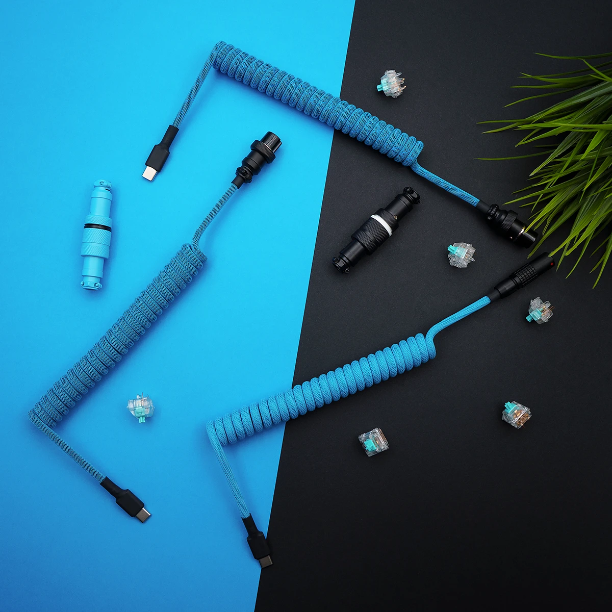 Custom coiled keyboard cable in vibrant blue paracord. Features USB-C and aviator connectors, detachable plugs, and a sleek braided finish.