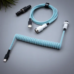 Coiled light blue keyboard cable featuring USB-C and aviator connectors, paracord design, and quality heatshrink for durable performance.
