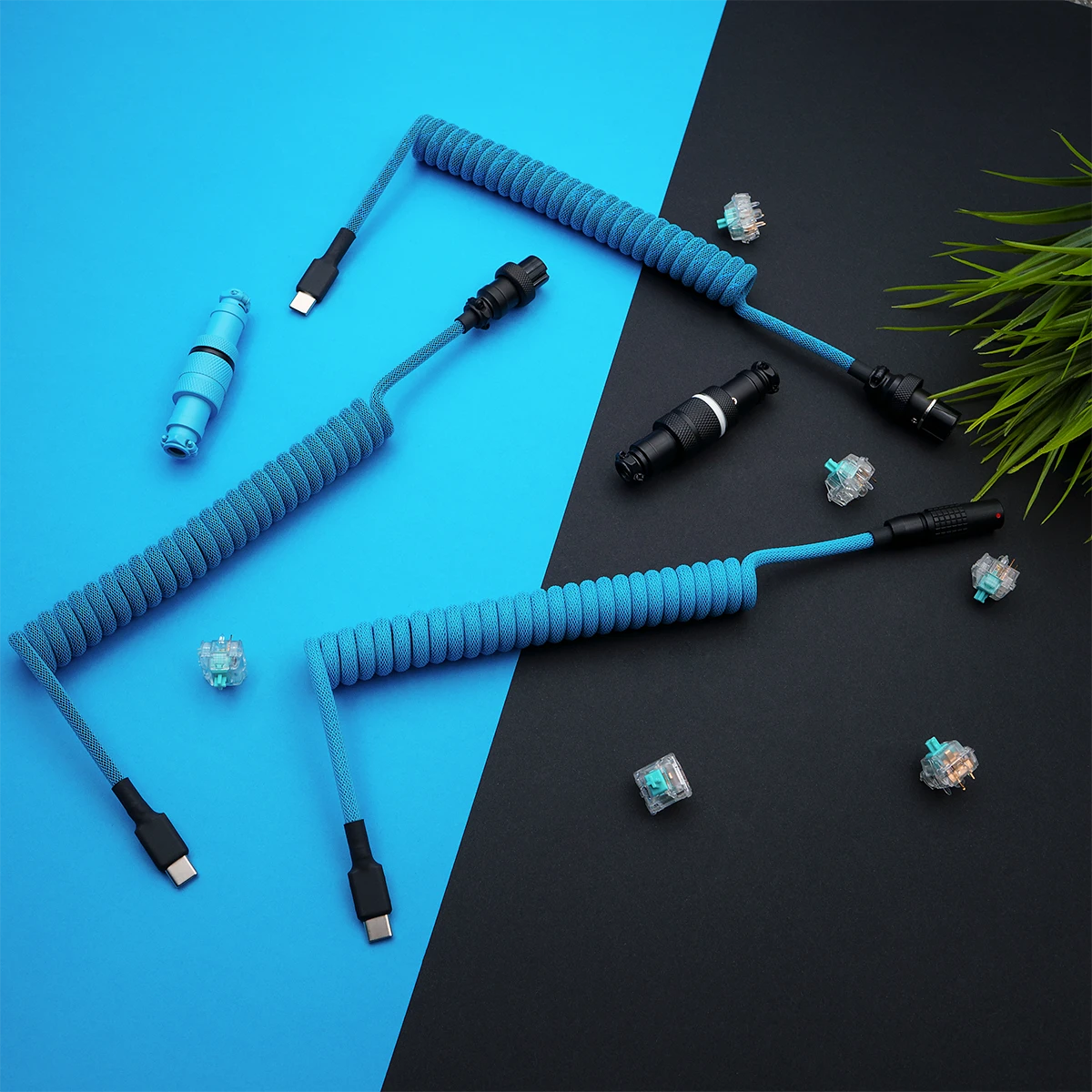 Bright blue coiled keyboard cables feature USB-C and AVIATOR connectors. The paracord finish and detachable plugs ensure durability and style.