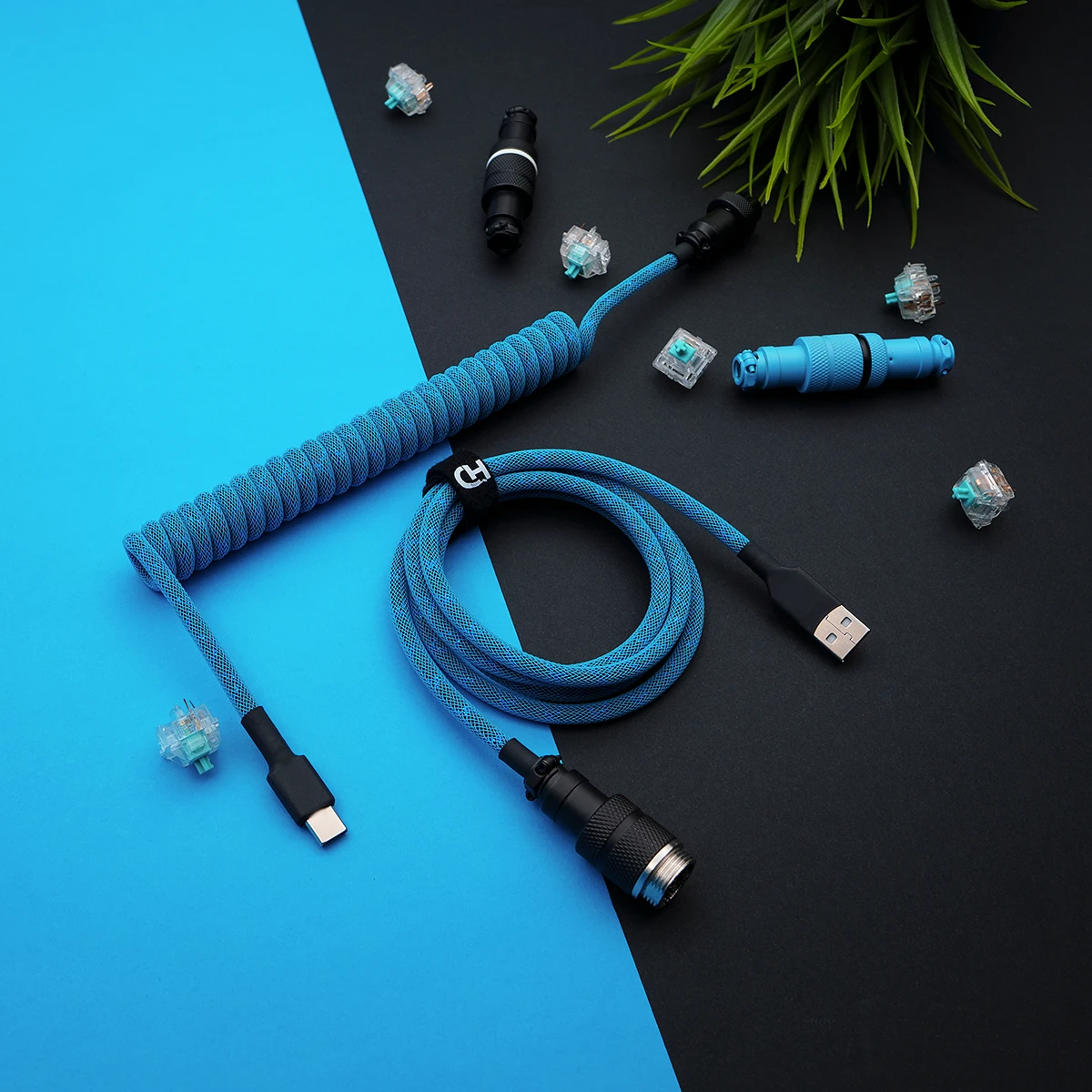 Coiled blue paracord cable with USB-C and aviator connectors. Features a smooth finish, excellent braiding, and detachable plugs for custom keyboards.