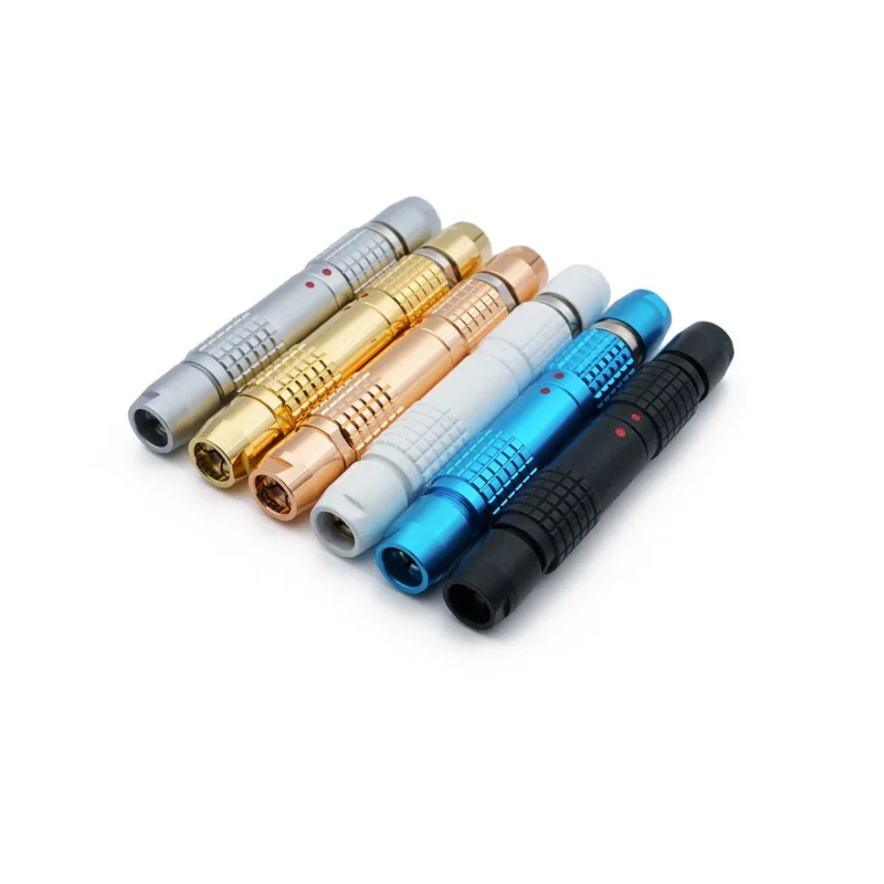 Six double-ended, cylindrical lemo-like connectors in silver, gold, copper, white, blue, and black, arranged side by side on a white background, resembling 4 pins Lemo-Like Connectors.