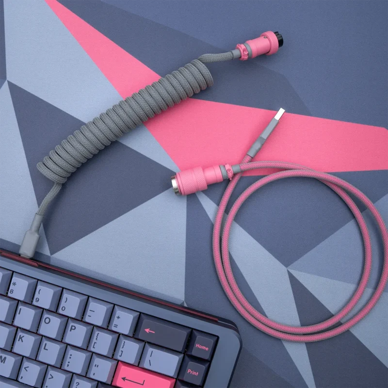 Custom GMK 80082 keyboard cable features a coiled design with gray paracord, detachable pink connectors, and smooth finish for durability and style.