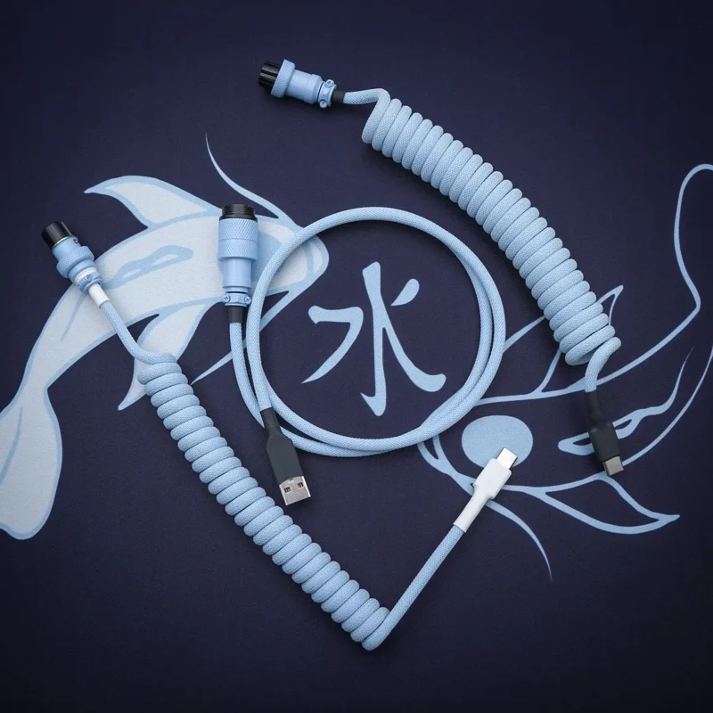 Custom keyboard cable featuring a blue paracord exterior, coiled sections, USB-C and aviator connectors, and quality heatshrink for durability.