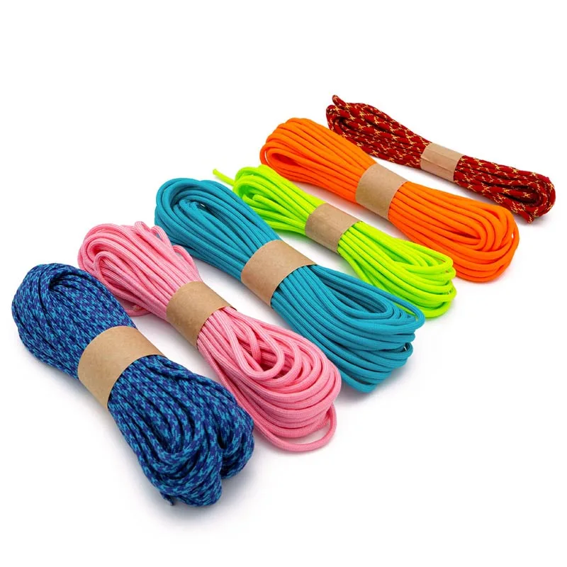 Five bundles of colorful 550 Paracord Genuine, each a different color : blue, pink, teal, neon yellow, orange, and patterned orange, perfect for crafting or a custom keyboard cable. Each bundle is neatly wrapped with paper bands.