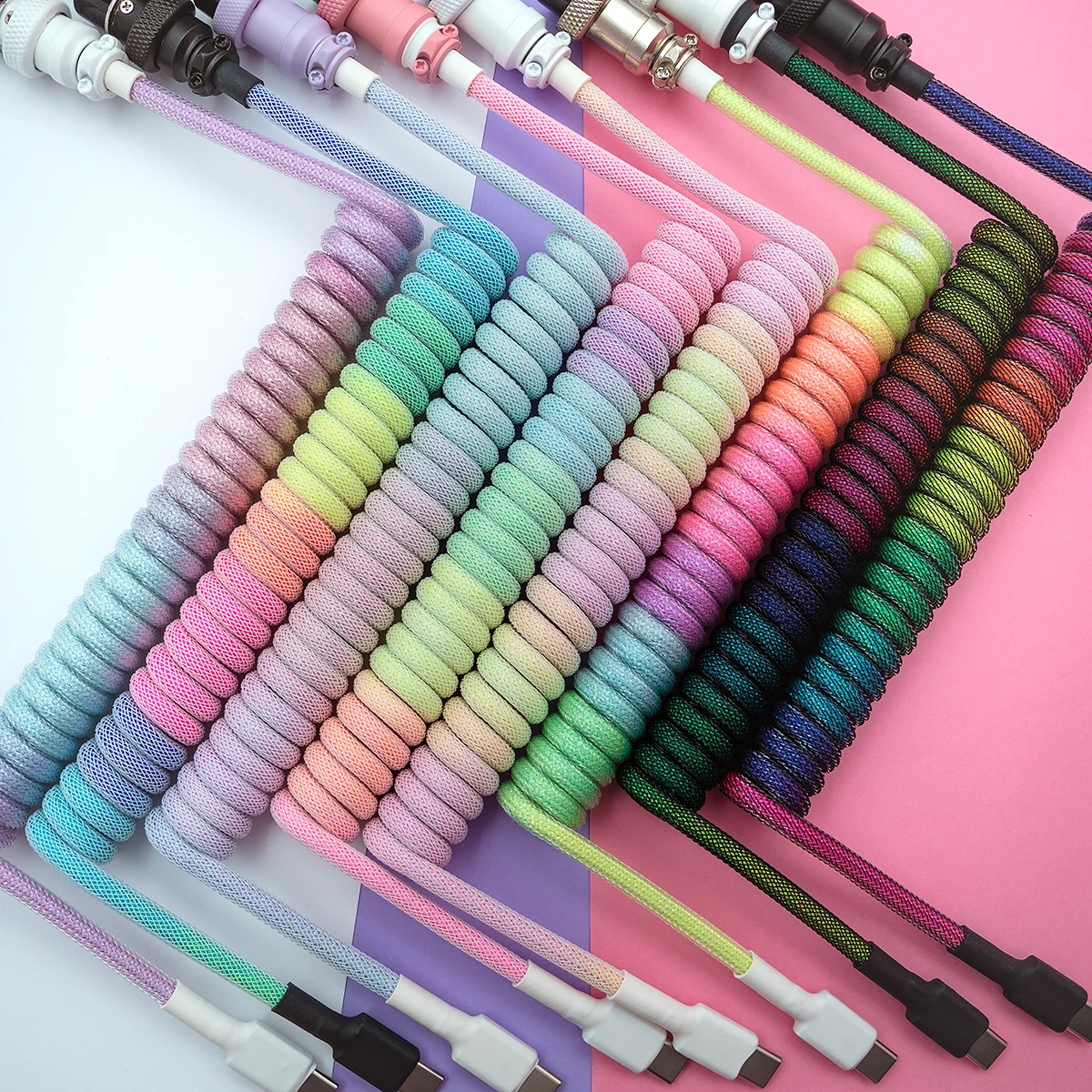 Vibrant rainbow-colored keyboard cables featuring textured paracord, various connectors (USB-C, aviator), and sleek CNC metal housing for durability.