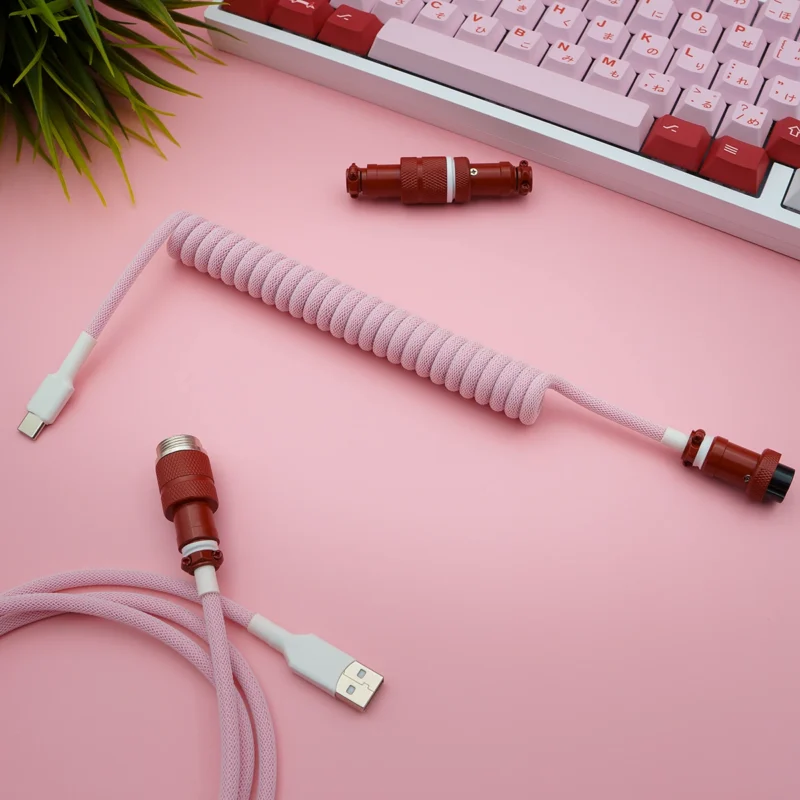 Custom GMK Darling keyboard cable featuring a pink coiled paracord design, USB-C connector, and detachable aviator plug for versatile use.