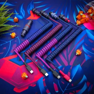 Coiled keyboard cables in vibrant colors feature USB-C and micro-USB detachable connectors. The durable paracord texture enhances the aesthetic appeal.