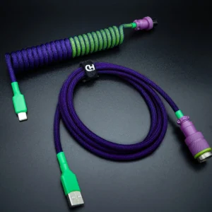 Coiled and straight custom keyboard cable featuring vibrant purple, green, and pink colors. USB-C and detachable aviator connectors combine style and functionality.