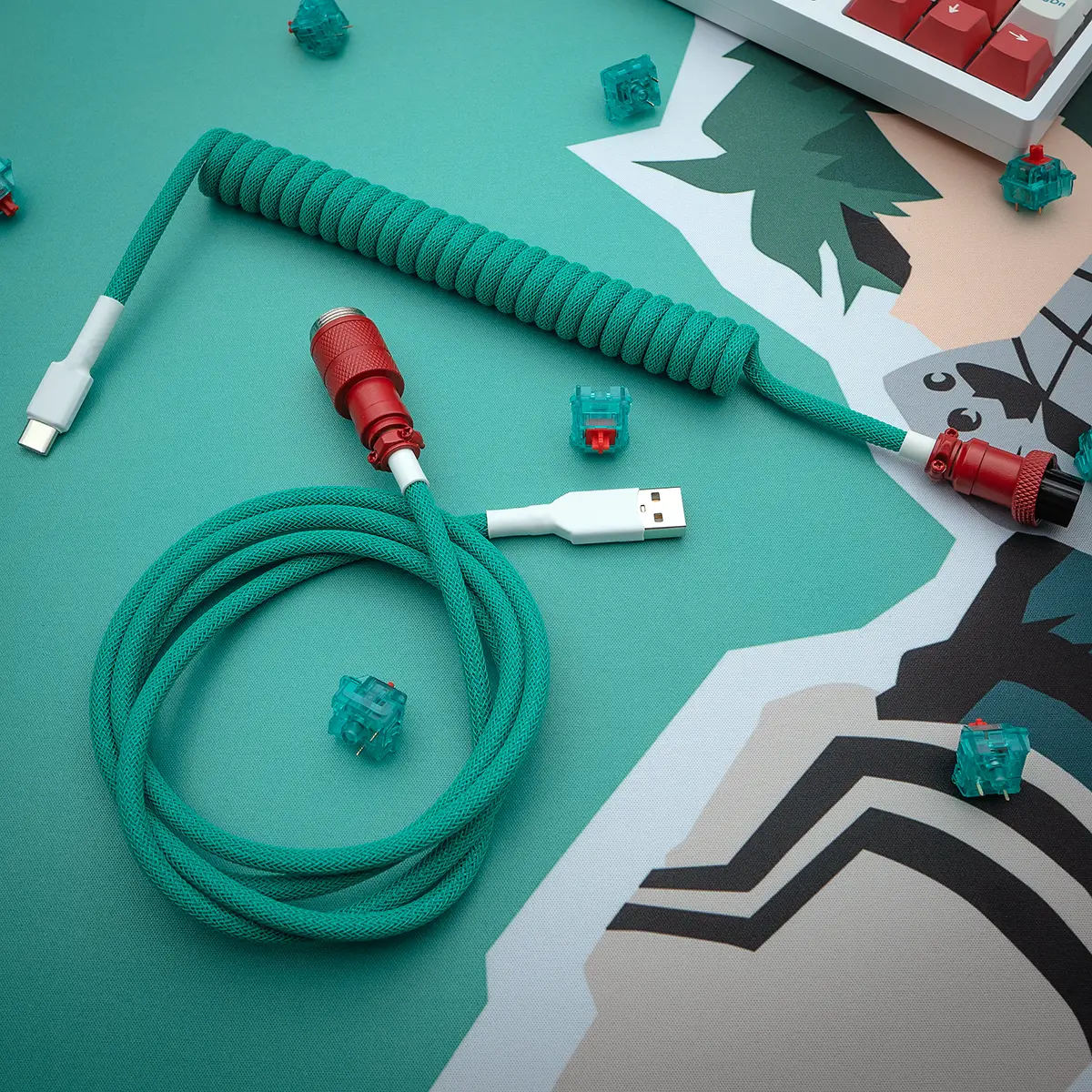 Coiled green keyboard cable with USB-C and aviator connectors, featuring a high-quality braiding and heatshrink finish for durability and style.