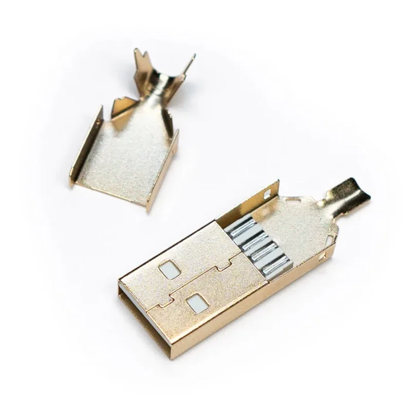 A disassembled USB 2.0 Type A - Solder Connector shell is shown with its top and bottom gold metal halves separated on a white background.