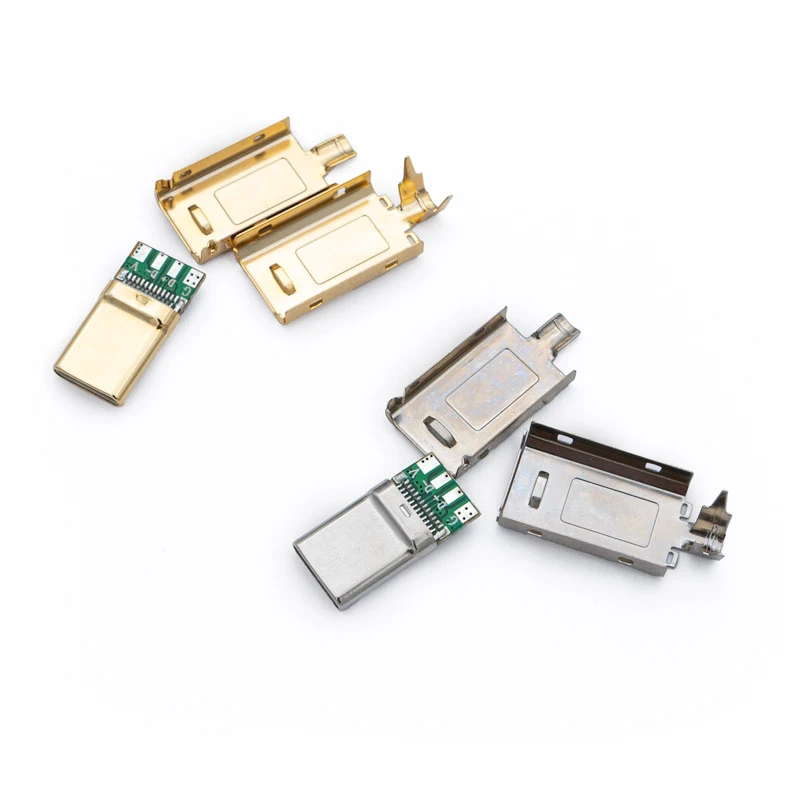 Four disassembled USB Type C 2.0 connectors with metal casings and exposed circuit boards are arranged on a white background.