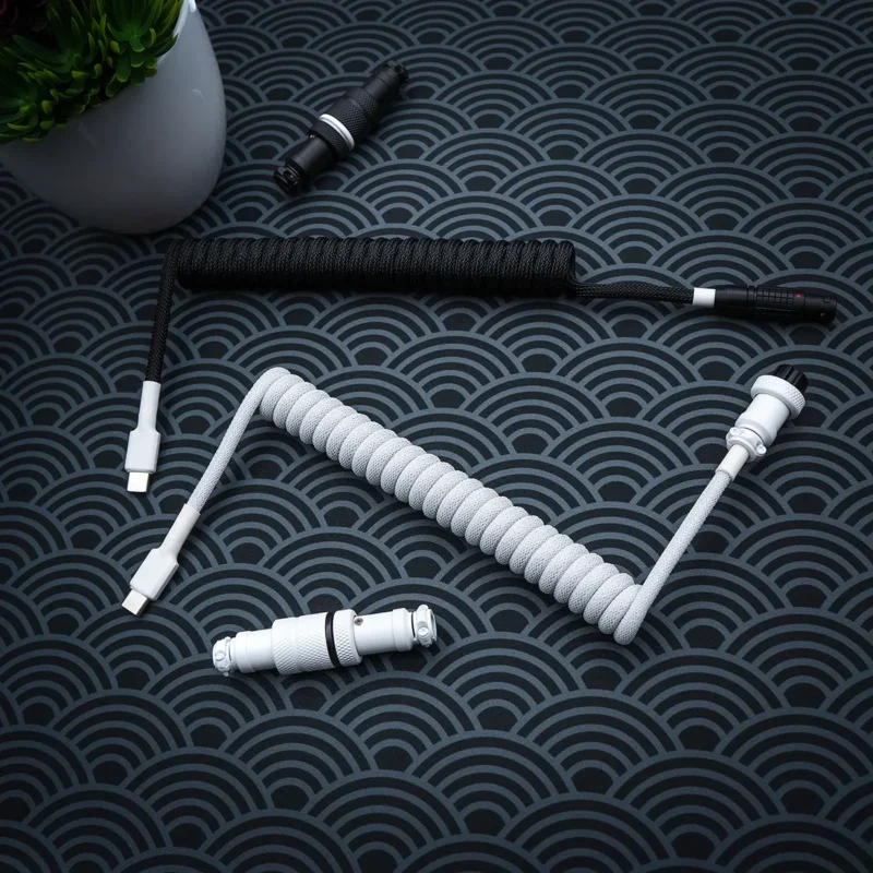 Custom keyboard cable featuring a white coiled Paracord design and USB-C connector. Includes a detachable, sleek CNC metal aviator plug for versatility.