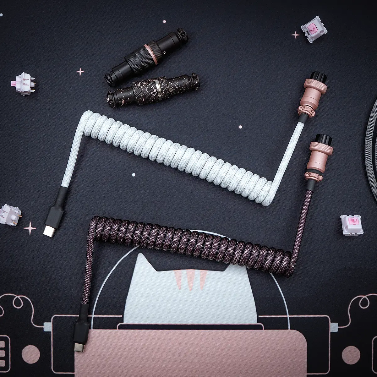 Custom keyboard cables in white and dark brown, featuring coiled designs, USB-C connectors, detachable plugs, and quality paracord braiding for durability.